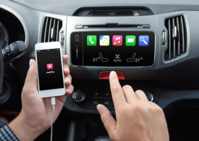 man connecting phone to the car media system